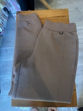 Nike Women’s Dri-FIT 24.7 Mid-Rise Ankle Length Training Pants in Taupe